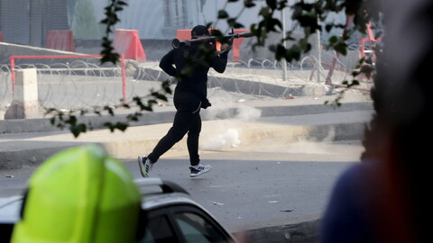 The Lebanese Red Cross reports six people were killed and dozens injured in the hours-long street battles. One of the victims, Mariam Farhat, a mother of five children, was killed by a stray bullet to her head inside her home. Another victim, 32-year-old Ali Ibrahim, who worked at a local gym and fitness diner, was killed while delivering food to a customer nearby. He was described as “an innocent soul” whose “smile never hides.” Tayouneh, Lebanon. October 14, 2021. (Marwan Tahtah/The Public Source)