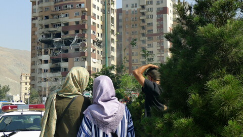 Two women standing in front of a building in Sa'adat Abad, Tehran.