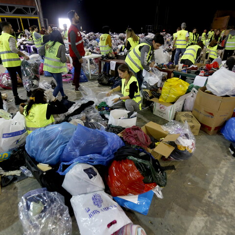 Volunteers sort donated food and clothes for the annual winter Dafa Campaign in Beirut, Lebanon. December 19, 2019. (Marwan Tahtah/The Public Source).