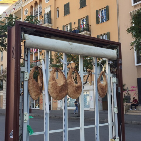 Ka'ak left hanging on a broken street sign for anyone in need. Beirut, Lebanon. October 29, 2019. (Bachir Asmar/Fawra)