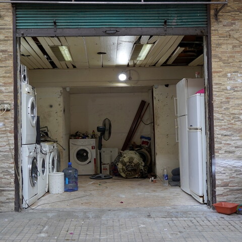 With new appliances now unaffordable, repair shops for washing machines, stove tops, and fridges have become a common sight in the neighborhood. Nabaa, Lebanon. June 26, 2021. (Mohamad Cheblak/The Public Source)