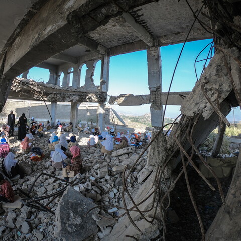 Children study in the rubble of their school that was destroyed by the violent war in the city of Taiz, Yemen. December 27, 2018. (Akram Alrasny/Shutterstock)