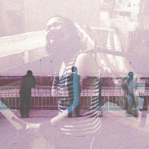 A composite of two images: a woman in the foreground, and people standing at a railing in the background, looking outward. There is a mosque on the horizon.