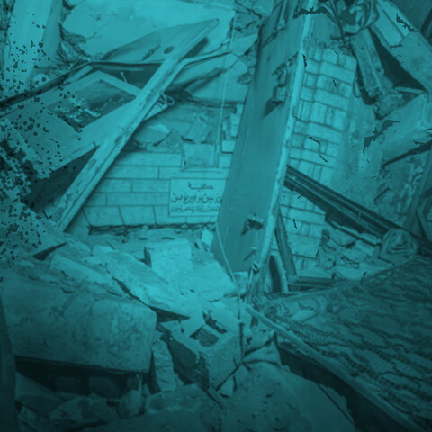 A blue-tinted image of ruins and destruction; there are pieces of the building everywhere.