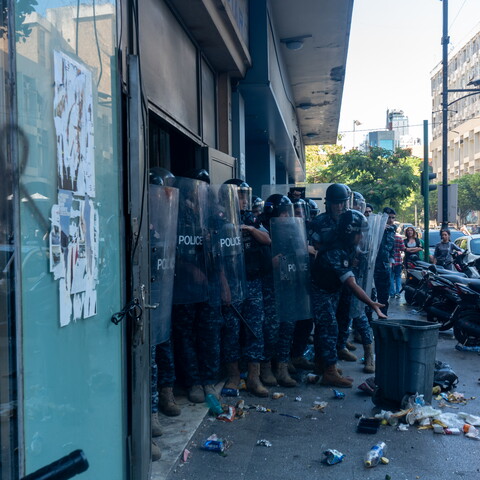 The Internal Security Forces surround the Hamra Star entrance and prevent displaced residents from entering the building. Beirut, Lebanon. October 21, 2024. (Fatima Joumaa/The Public Source)