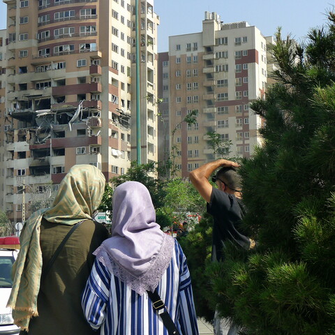 Two women standing in front of a building in Sa'adat Abad, Tehran.