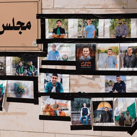 Pictures of student martyrs and prisoners are displayed outside the student council office at Birzeit University