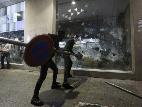 Protesters smash the storefront of Bank of Beirut’s branch on Hamra St. during the "Night of the Banks." Beirut, Lebanon. January 14, 2020. (Marwan Tahtah/The Public Source)