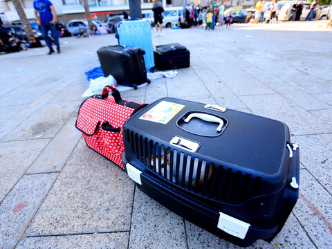 Displaced civilians' belongings and luggage on Beirut's streets. 