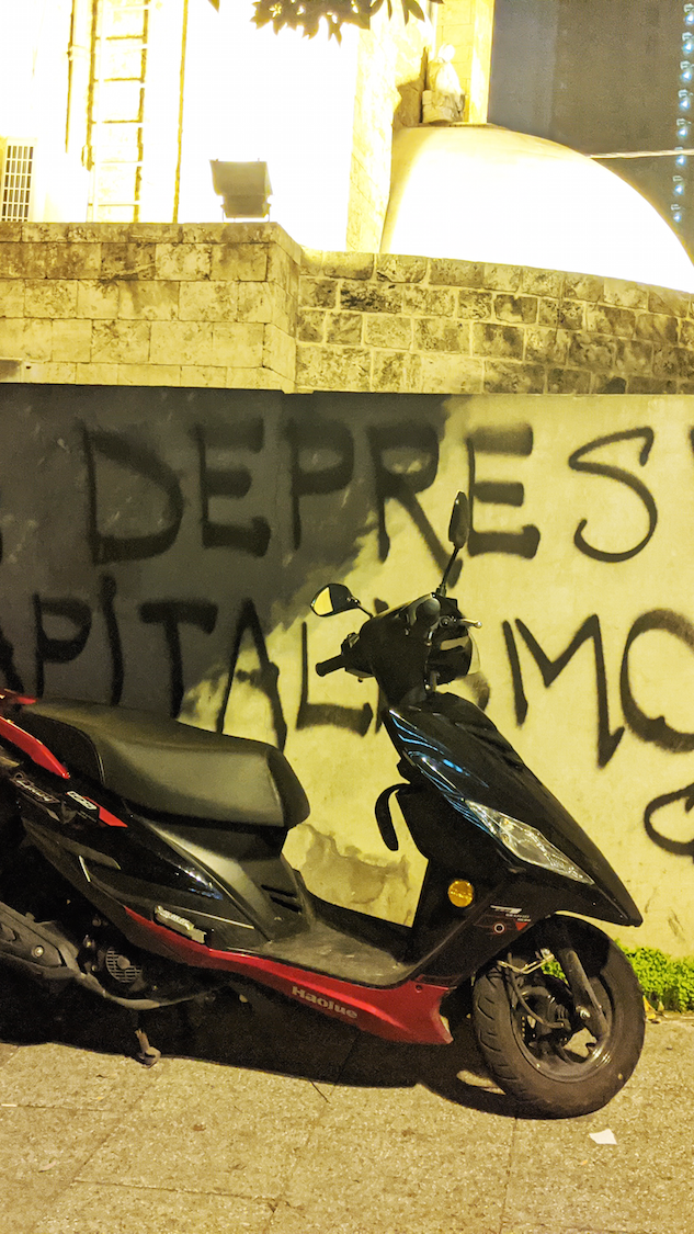 Inspired by a banner carried by protesters Chile, "it's not depression, it's capitalism” reads this wall in Beirut, Lebanon. December 4, 2019. (Lara Bitar/The Public Source)