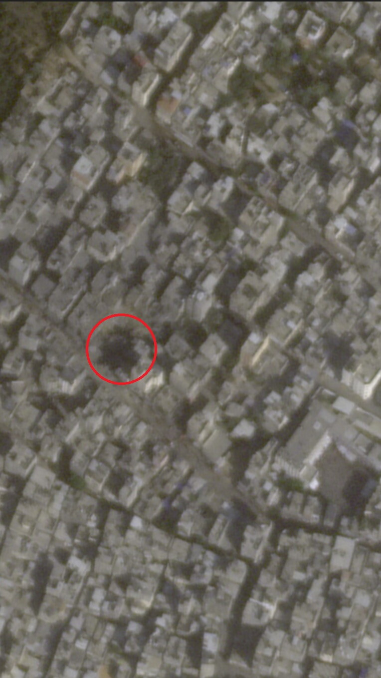 A satellite image of a crater where al-Maghazi al-Jadeed Bakery once stood.