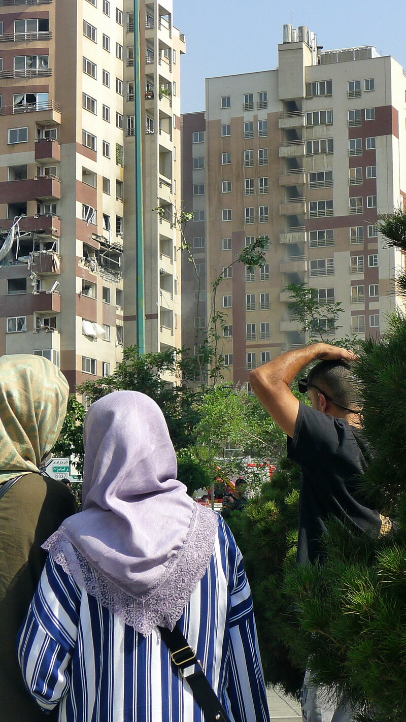 Two women standing in front of a building in Sa'adat Abad, Tehran.