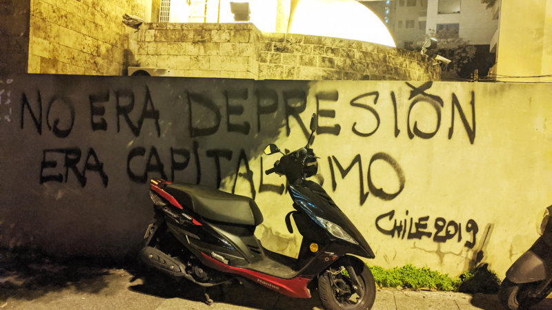 Inspired by a banner carried by protesters Chile, "it's not depression, it's capitalism” reads this wall in Beirut, Lebanon. December 4, 2019. (Lara Bitar/The Public Source)