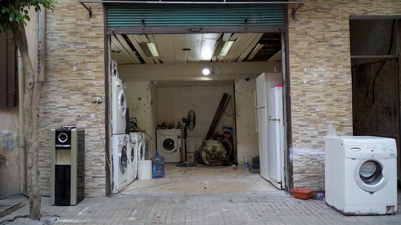 With new appliances now unaffordable, repair shops for washing machines, stove tops, and fridges have become a common sight in the neighborhood. Nabaa, Lebanon. June 26, 2021. (Mohamad Cheblak/The Public Source)
