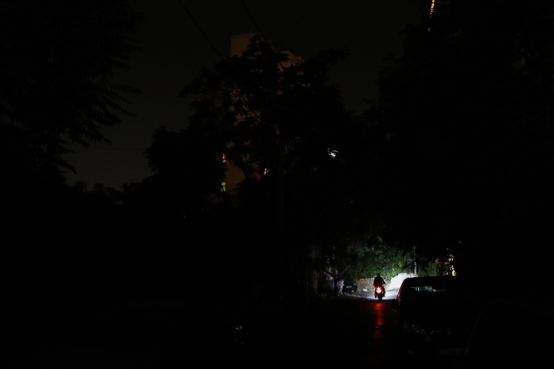 Beirut in darkness; a motorcycle lights up the street. Beirut, Lebanon. August 28, 2020. (Marwan Tahtah/The Public Source)