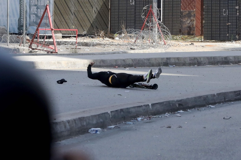 A man, carrying an RPG-7, ran into the middle of the street to fire a rocket but was shot and immediately killed before he launched it. Prime Minister Najib Mikati announced the closure of all public and private administrations and institutions on Friday, October 15, to "mourn the souls of the martyrs." President Michel Aoun described today’s events as “painful” and “unacceptable.” Aoun called for an investigation into today's violence, adding it to a pile of old, open, and unresolved investigations. The fa