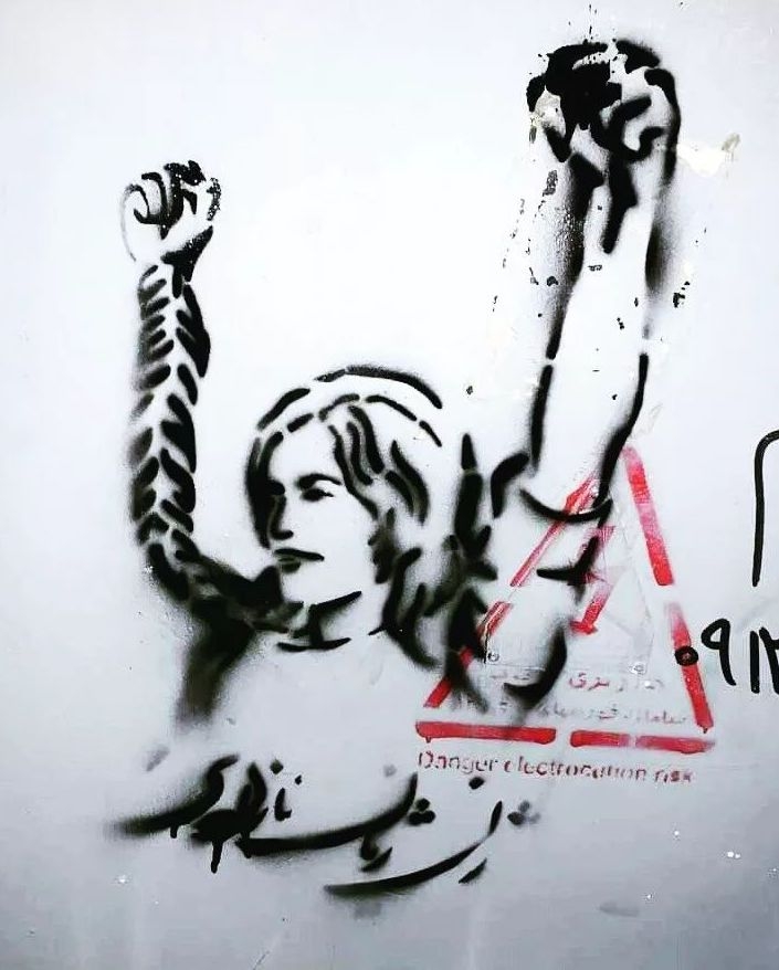 Stencil of woman holding up her fists