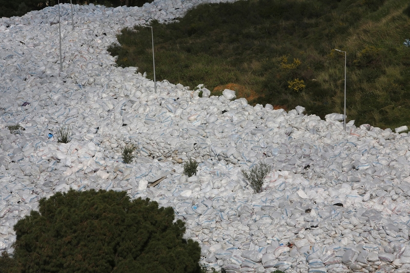 A “river of trash” consumes a main road.