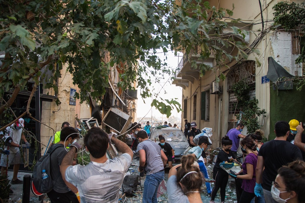 Volunteers and residents cleanup destroyed Mar Mikhael near the Beirut Port.