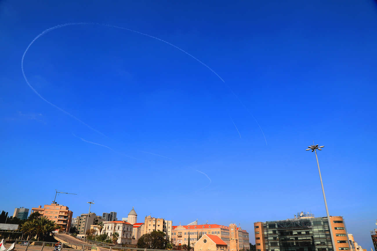 Vapor trails streak the Beirut sky