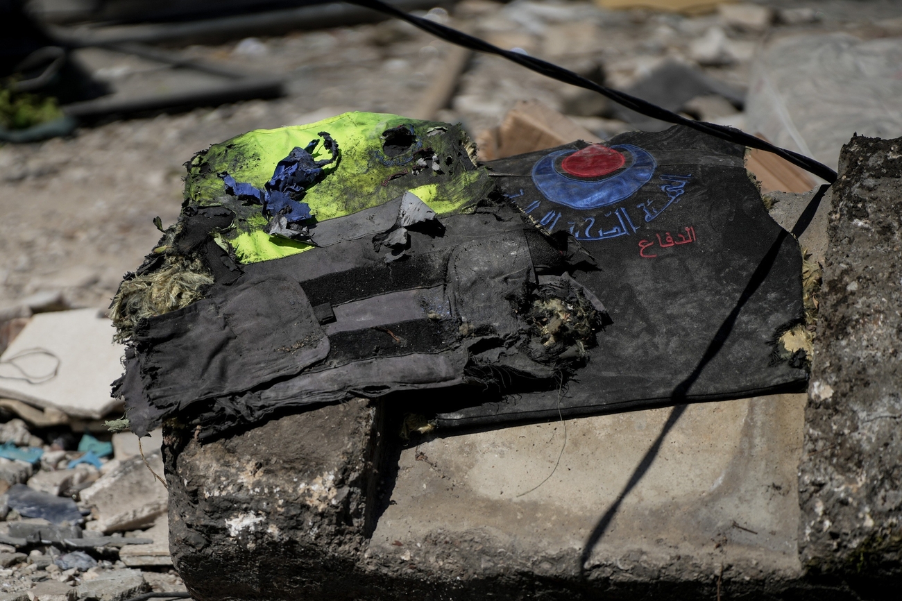 A medical worker's vest amid the rubble