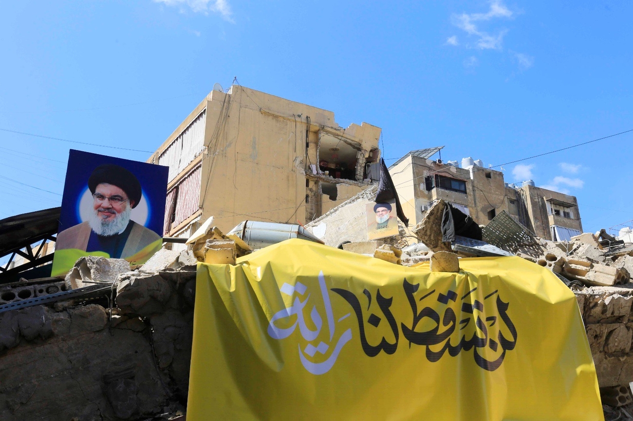 A photo of Nasrallah placed on a damaged building in Dahieh