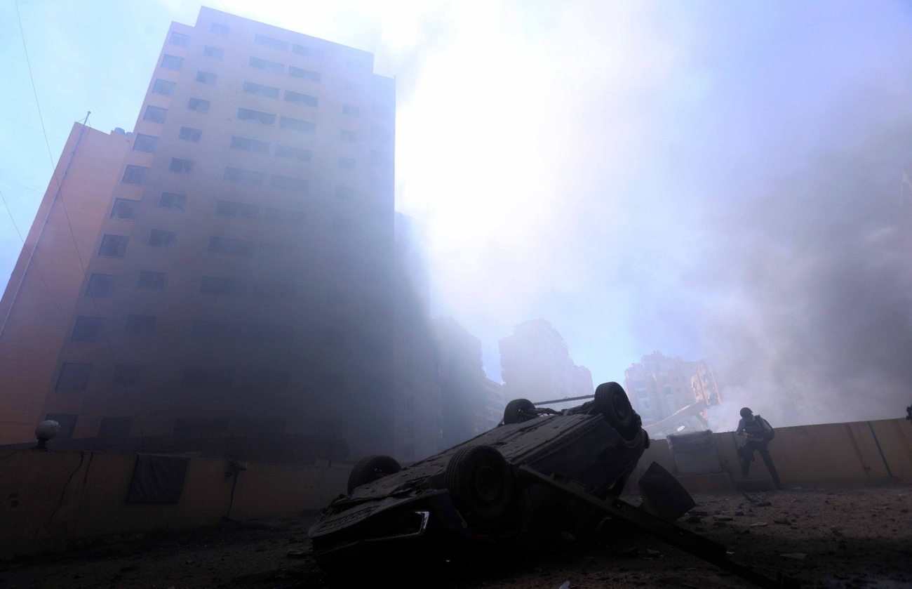 Smoke and rubble in Dahieh