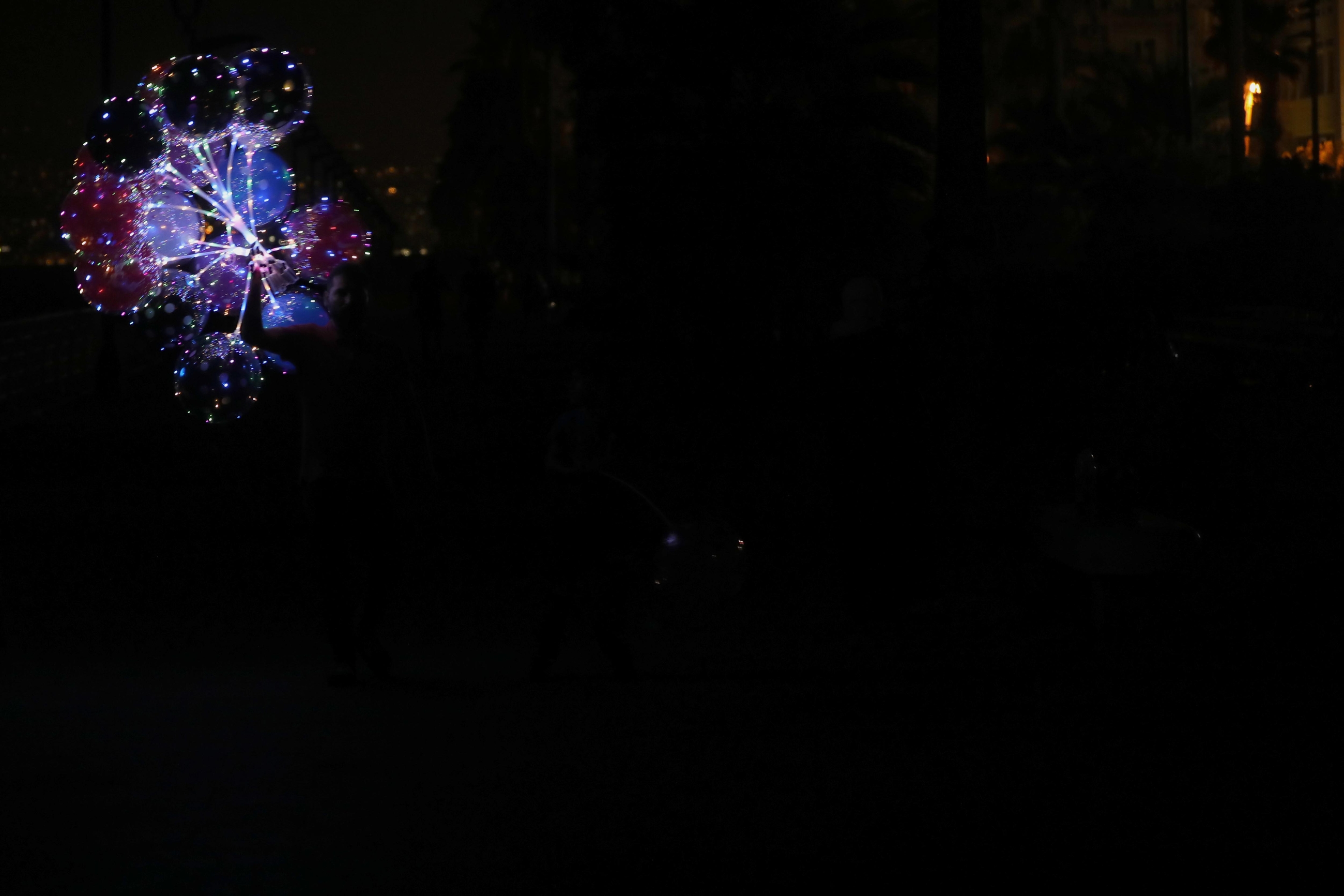 Beirut in darkness; glow-in-the-dark balloons. Beirut, Lebanon. August 28, 2020. (Marwan Tahtah/The Public Source)