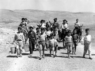Children in Akkar on their way to fill up water from a well, July 1967. 
