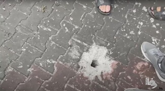 A screenshot of a hole in the ground formed by a projectile.