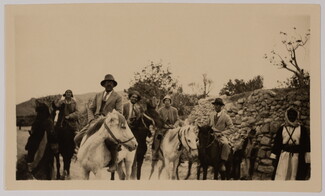 A group of people, including Khalil Totah, pose while horseback riding. 