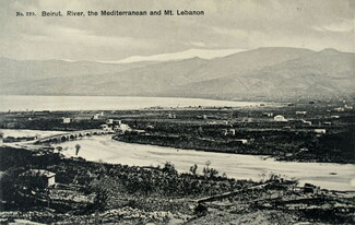 Old postcard image of the Beirut River in Lebanon. In the background, buildings are scattered across the rural mountainside.