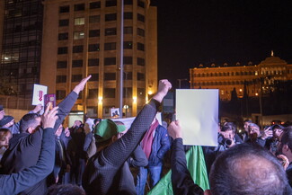 Protestors in Riad al-Solh Square chant and raise their fists in solidarity with displaced southerners and to call on the government to protect them.