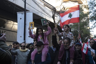 Protestors march, holding up posters of martyred loved ones, and loved ones the Israeli occupation is holding captive in its detention centers.
