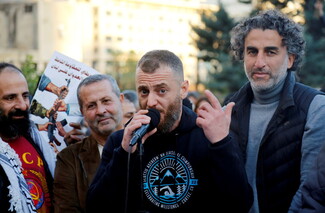 A man giving a speech at a rally in Beirut, downtown. 