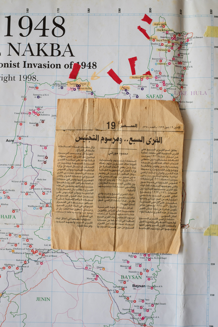 Map of Palestine and old newspaper clipping