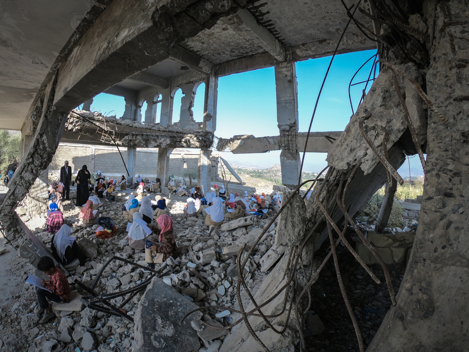 Children study in the rubble of their school that was destroyed by the violent war in the city of Taiz, Yemen. December 27, 2018. (Akram Alrasny/Shutterstock)