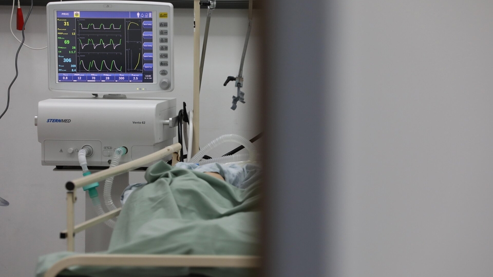 A monitor displays the vital signs of a patient.