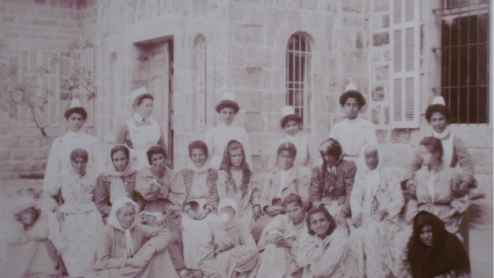 An archival photograph from 1904 showing 15 working-class female patients and 6 medical staff in front of Philadelphia House at Asfuriyyeh. Hazmieh, Lebanon. 